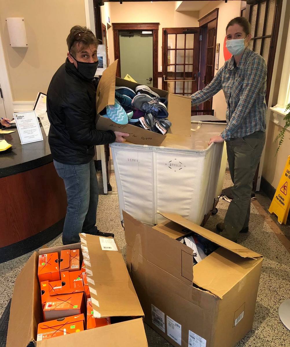 Sneakerama owner donating shoe to a local charity in Worcester